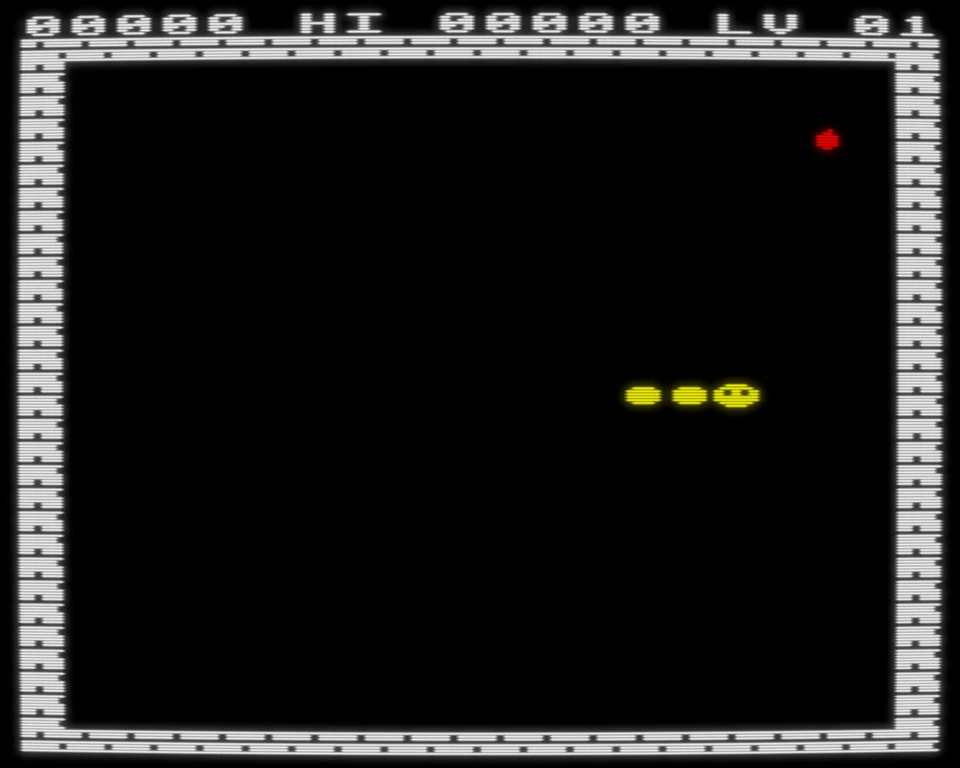 The original Wyrm on the BBC Micro: a short yellow Wyrm heading for a red apple inside a brick-walled arena